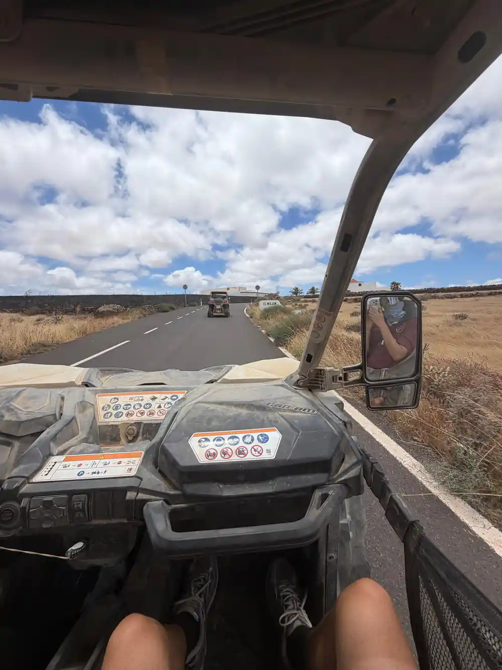 View from buggy dashboard on highway with vehicles