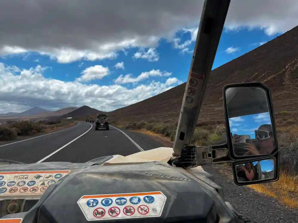 View from truck cab on volcanic landscape road